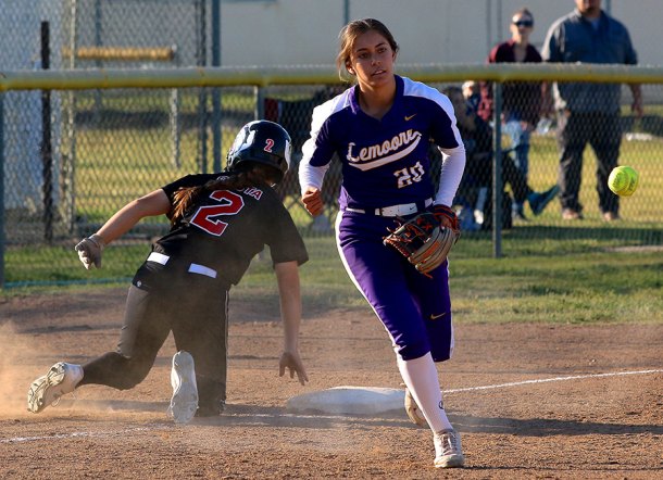 Lemoore's Susannah Campos tosses the ball after tagging a Hanford runner in Tuesday's 6-1 loss to Hanford. 
